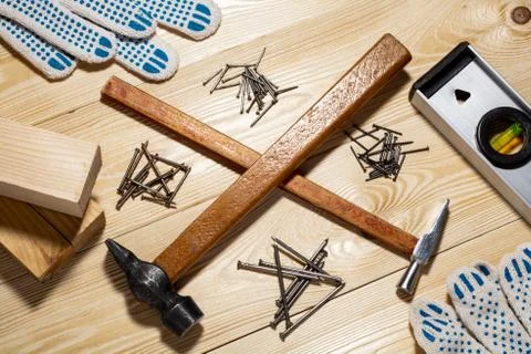 Two hammers and nails. concept of home improvement Stock Photos