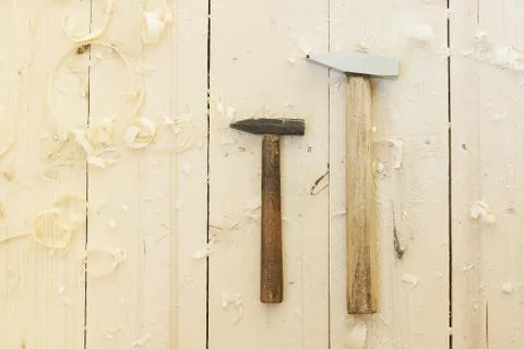 Two hammers on the floor Stock Photos