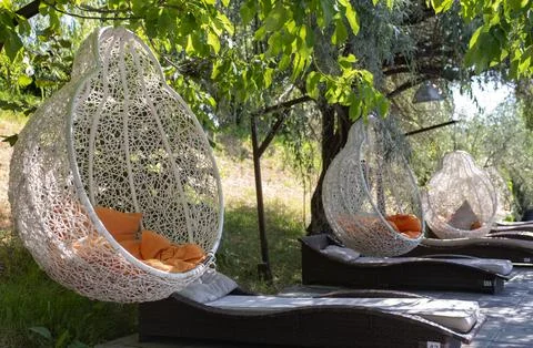 Two hammocks in the shade of a tree on a sunny day Stock Photos