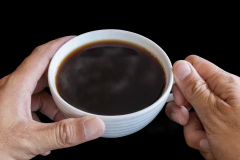 Two hand man hold the white coffee cup wiht hot black coffee in side. Save wi Stock Photos