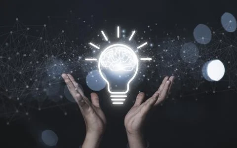Two hand showing virtual lightbulb with brain on blue bokeh background Stock Photos