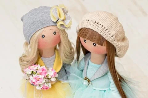 Two handmade rag dolls - blonde and brown-haired. view from the top Foto stock