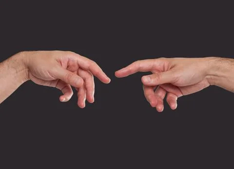 Two hands about to touch Stock Photos
