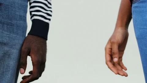 Two hands of African young couple in love on white background. Couple holding Stock Footage 81839840