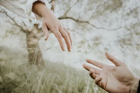 Two hands apart reaching for each other man and woman Stock Photos