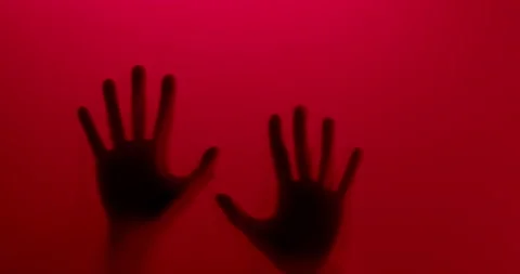 Two hands appear and scratch down. Abstract. Red background Stock Footage 133933615