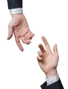 Two hands are reaching each other. Help and assistance concept. Isolated on w Stock Photos