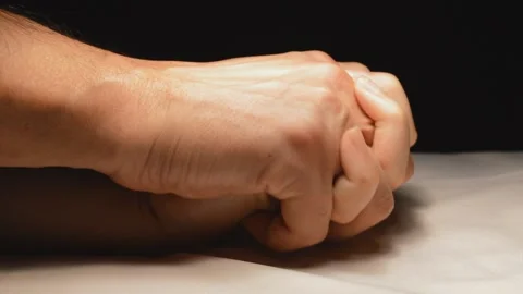 Two hands in bed with black background Stock-Footage 96292222