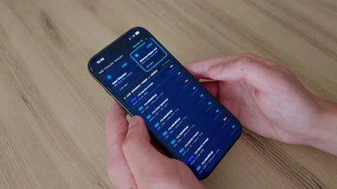 Two Hands Checking AI Server Infrastructure Dashboard on Smartphone Stock Footage 347682003