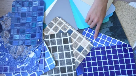 Two hands choosing design of swimming pool Stock Footage 249940473