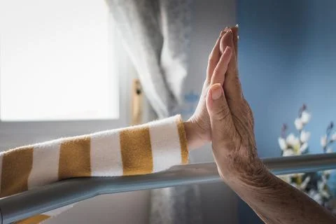 Two hands colliding on a bed Stock Photos