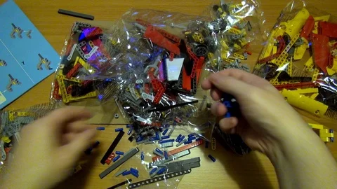 Two  Hands constructing  Technic Lego Stock Footage 117438328