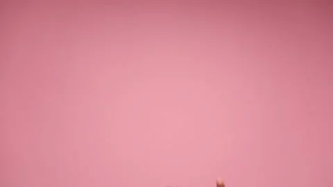 Two hands entering, pointing the index finger up, wearing bracelets and rings, Stock Footage 136093552