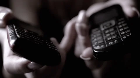 Two Hands Exchanging Mobile Phones in a Modern Digital Device Interaction for Stock Footage 312014425