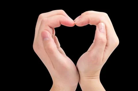 Two hands form a heart shape Stock Photos