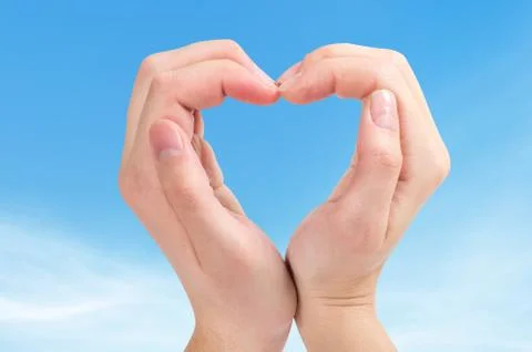 Two hands form a heart shape Stock Photos