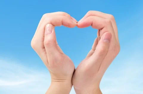 Two hands form a heart shape Stock Photos