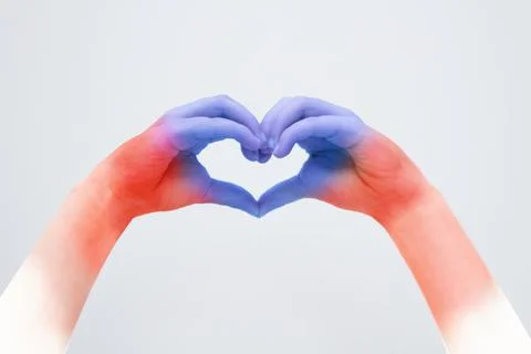 Two hands forming a heart shape from fingers. Stock Photos
