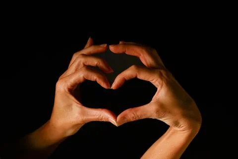 Two hands forming a heart shape with curved fingers, symbolizing affection Stock Photos