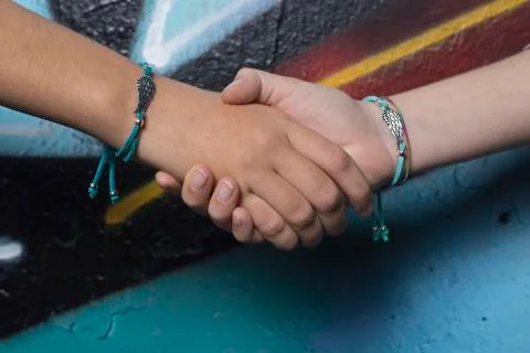 Two hands of friends  Stock Photos