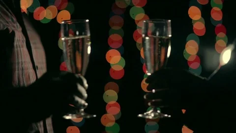 Two hands with glasses of champagne clink and drink . Stock Footage 81323382