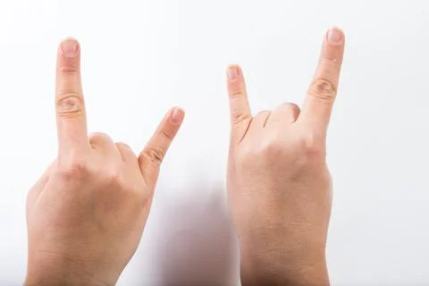 Two hands with goat gesture Stock Photos