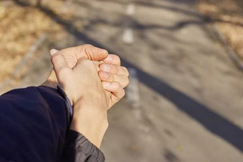 Two hands held tightly together as one the concept of love friendship Stock Photos