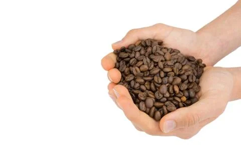 Two hands holding coffee beans Stock Photos