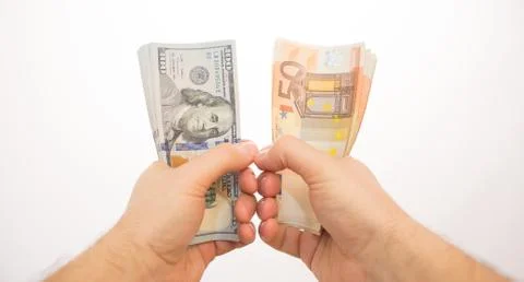 Two hands holding dollars and euros isolated Stock Photos