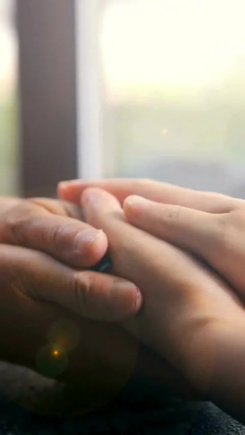 Two hands holding each other in a supportive gesture Video stock 331933183