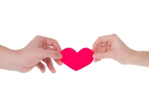 Two hands holding a red heart shape on a white background Stock Photos