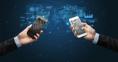 Two hands holding smartphones to sync business data 写真素材