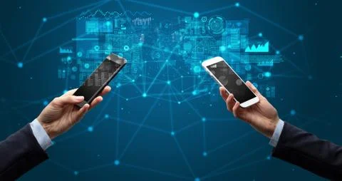Two hands holding smartphones to sync business data Stockfoto's
