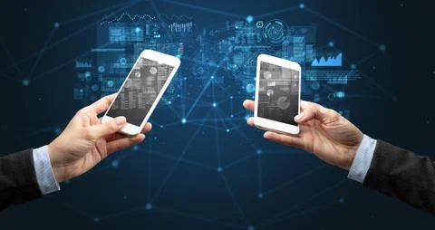 Two hands holding smartphones to sync business data Stock Photos