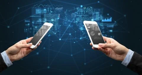 Two hands holding smartphones to sync business data 库存照片