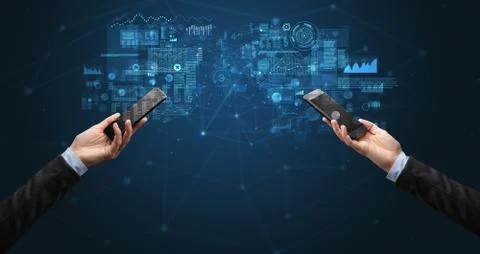 Two hands holding smartphones to sync business data 写真素材