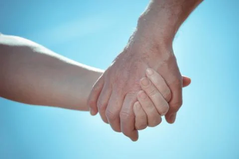 Two hands holding together Stock Photos