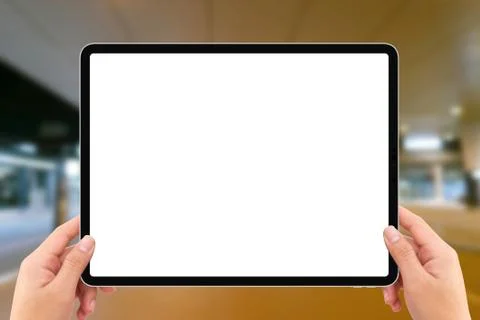 Two hands holding white screen mockup tablet computer in airport terminal tra Stock Illustration