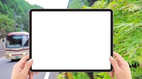 Two hands holding white screen mockup tablet computer, bus and road in Japan  Stock Illustration