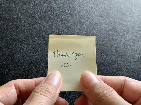 Two Hands Holding Yellow Note Handwritten Thank You Message Stock Photos