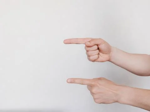 Two hands with indicate the direction on a light background Stockfoto's