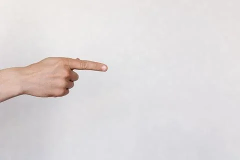 Two hands with indicate the direction on a light background Stock Photos