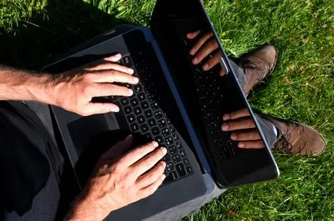 Two hands on a keyboard. Digital nomad Stock Photos