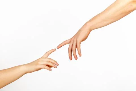 Two hands on a light background, a replica of the plot of Michelangelo's The  Foto stock