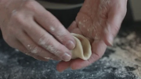 Two hands making meat dumplings. Stock Footage 74519608