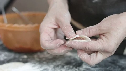 Two hands making meat dumplings. Stock-Footage 74524241