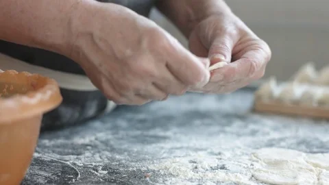 Two hands making meat dumplings. 動画素材 74524479