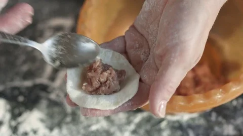 Two hands making meat dumplings. Stock Footage 74526607