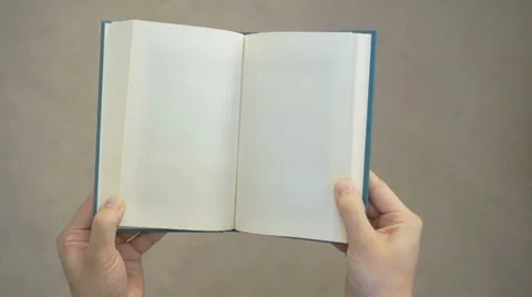 Two hands opening a book with blank page, Stock Video