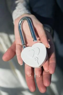 Two hands with the padlock Stock Photos